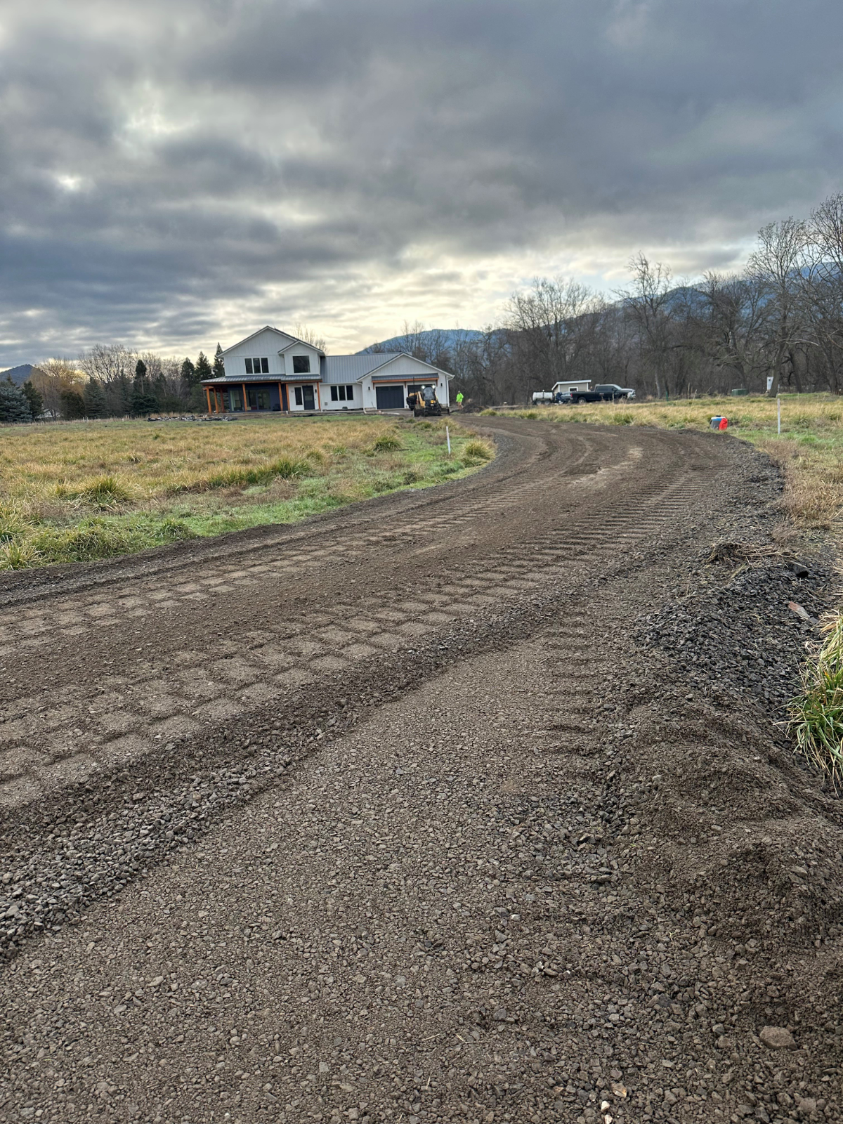 Graded gravel driveway base preparation by Musser Sealcoat and Paving Inc.