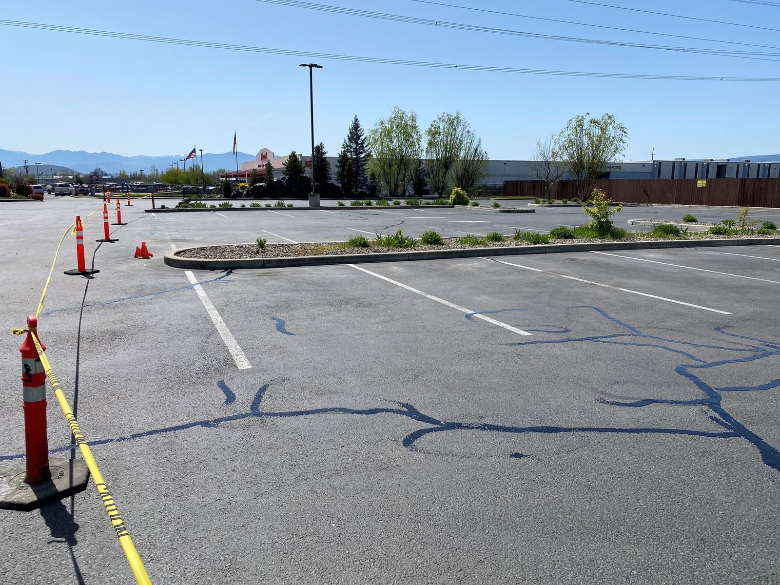 Commercial parking lot crack sealing by Musser Sealcoat and Paving Inc.